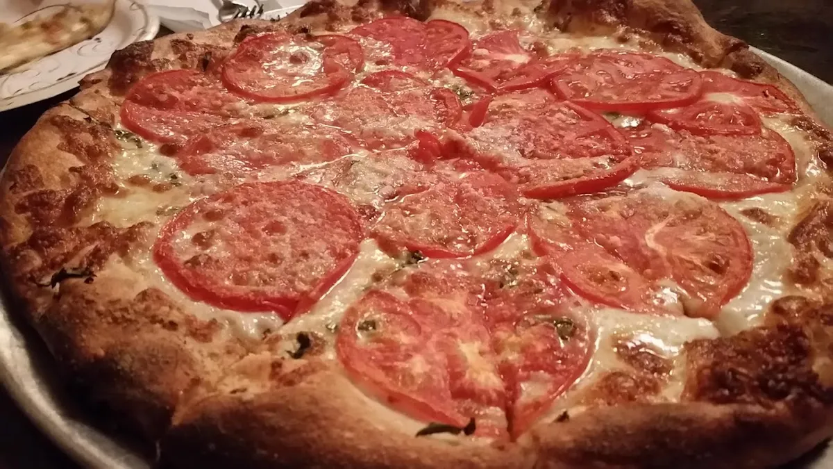 Tomato-topped pizza at Ernie's Pizza & Restaurant